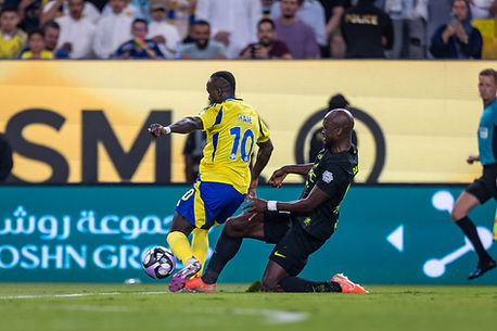 Fans cheering at a Saudi Pro League match