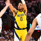 Donovan Mitchell drives past defenders in Cavaliers playoff action