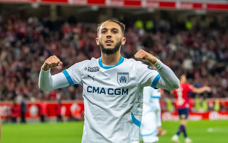 Amine Gouiri and Olympique Marseille players celebrating their Ligue 1 victory