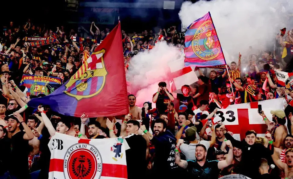 Travis Scott performing at a surprise Barcelona concert with local football stars