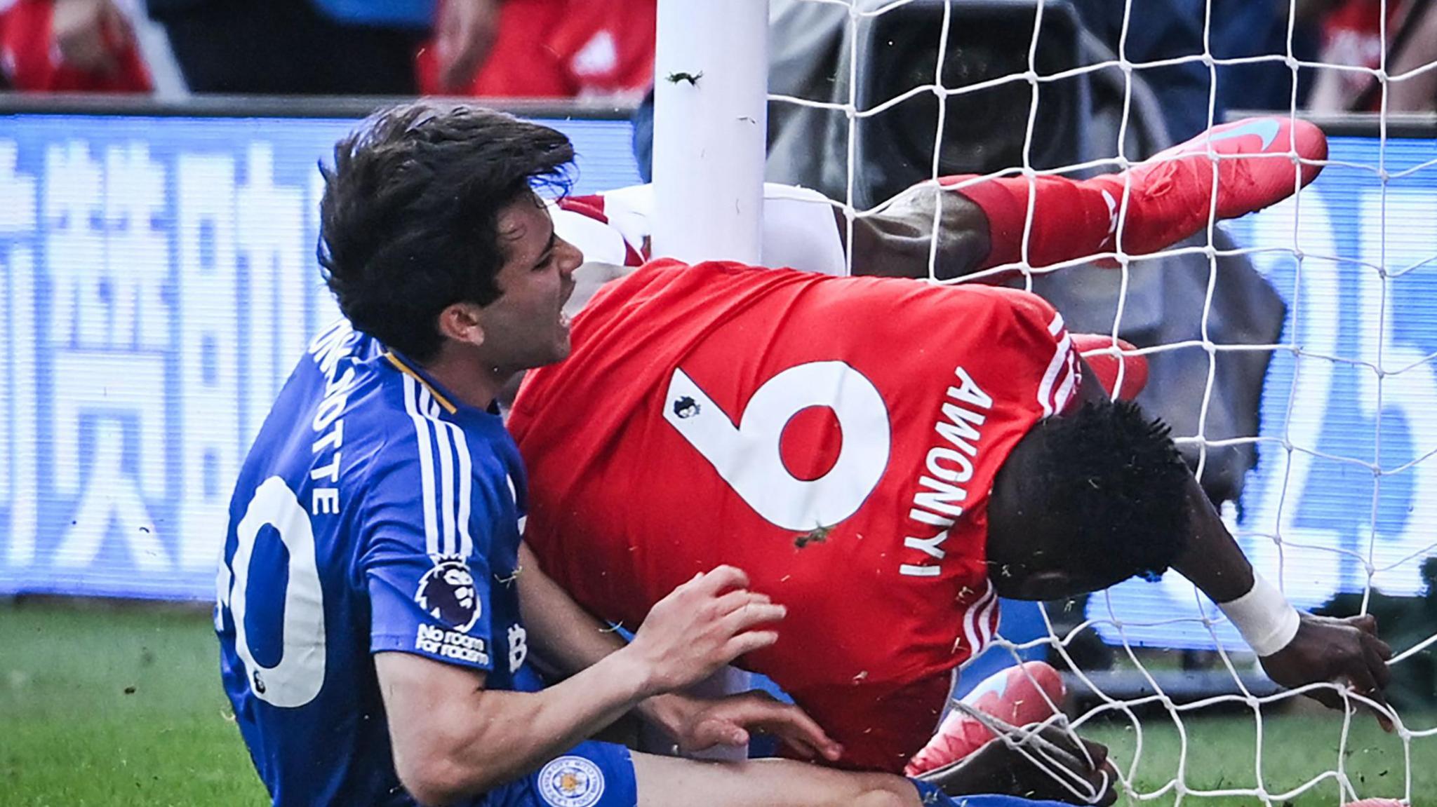 Taiwo Awoniyi receiving medical attention against Leicester City