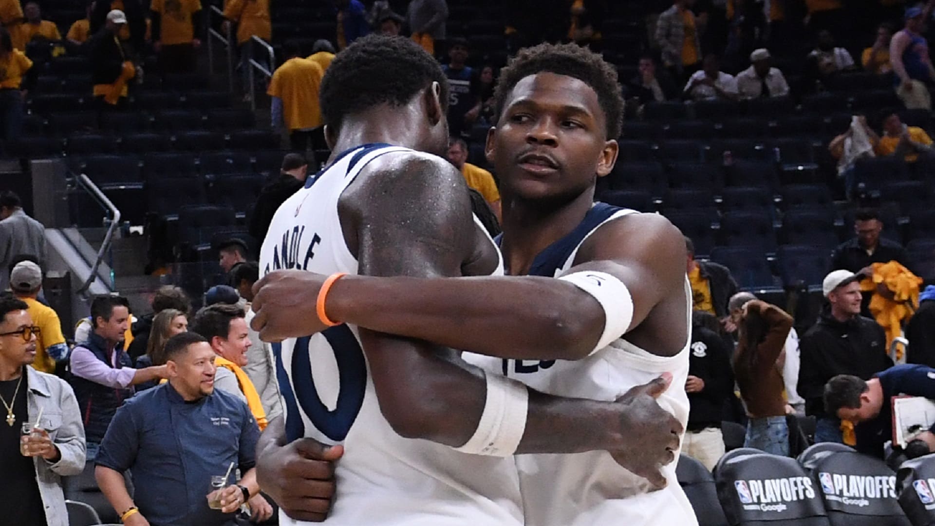 Chris Finch coaching Timberwolves players during a heated NBA playoff game.