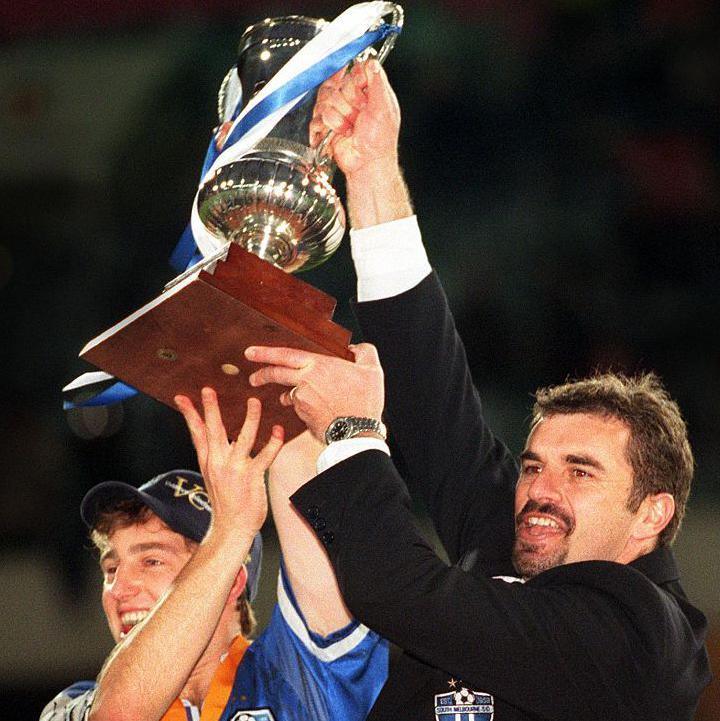 Ange Postecoglou celebrating with Tottenham players after the Europa League final win